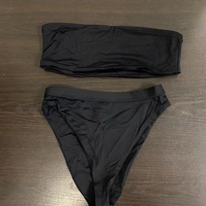 Womens black Dippin Daisy’s black swim suit, top size medium, bottom size small